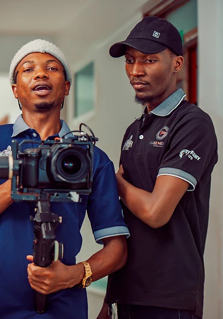 Two crew members with a gimbal camera