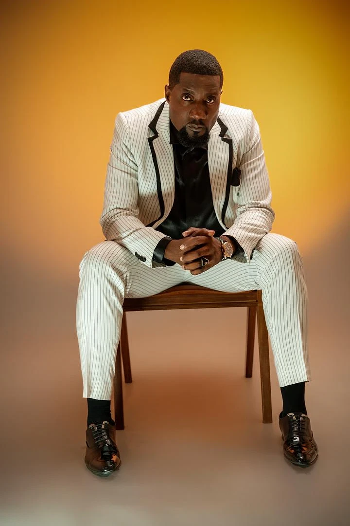 Salim A. Issa (Gabo Zigamba), founder of Gabz Media, in a white striped suit