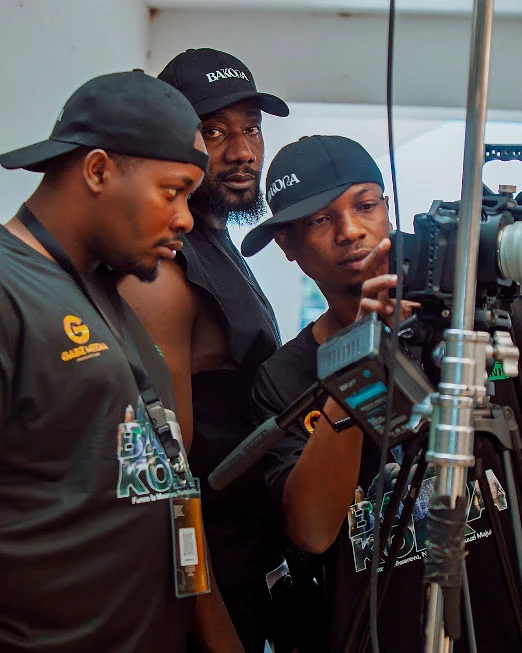 Crew reviewing a shot on the camera monitor