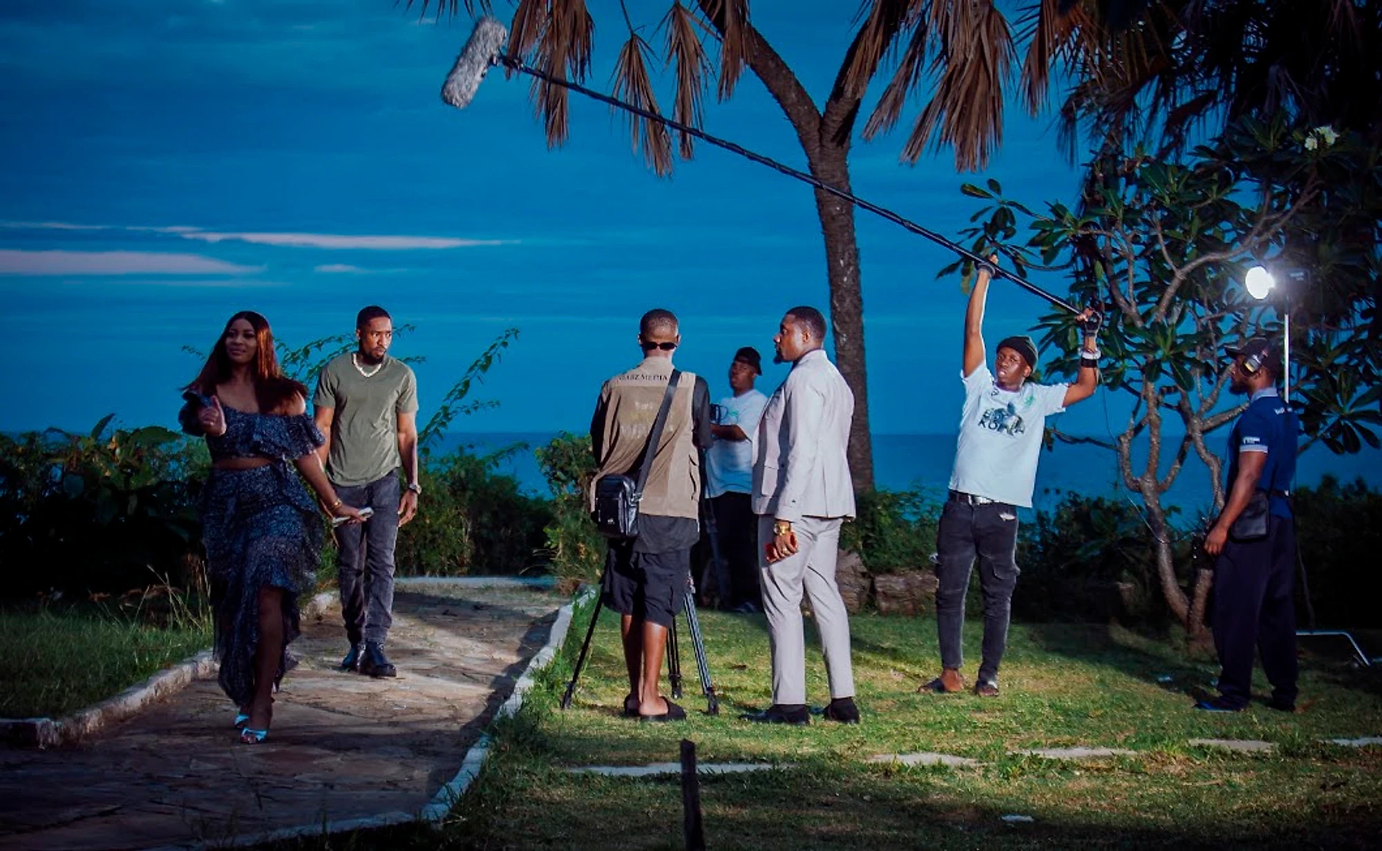 Gabz Media crew filming a night scene by the sea